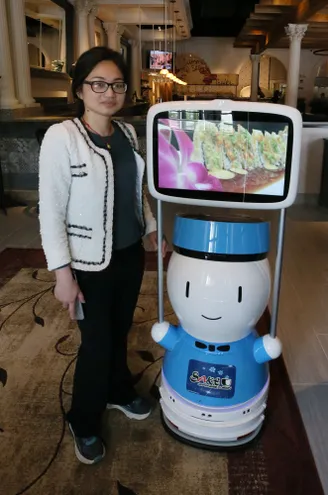 Japanese restaurant at Summit Mall employs robot host, servers to combat labor shortage